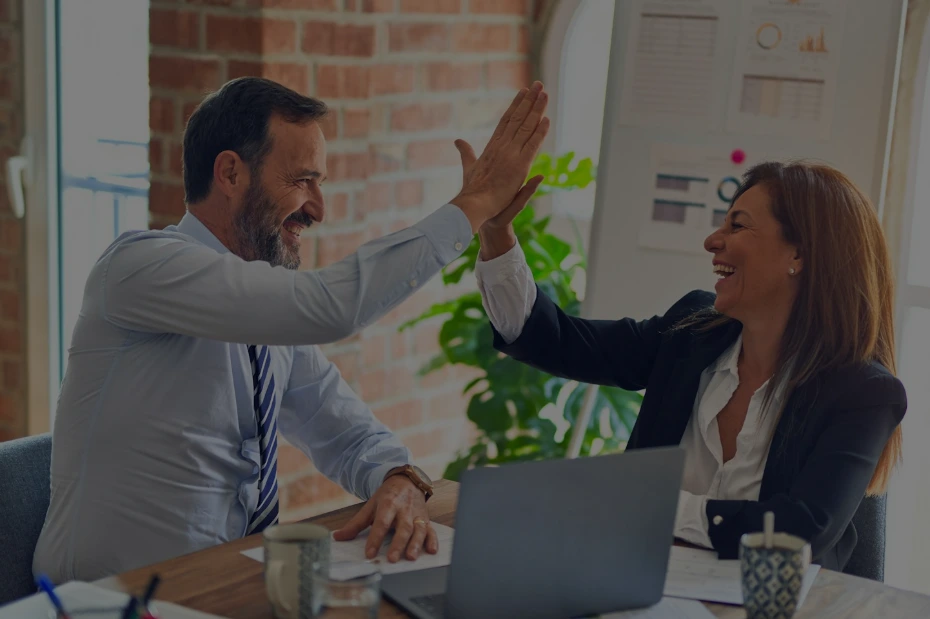 man in white dress shirt sitting beside woman in black long sleeve shirt